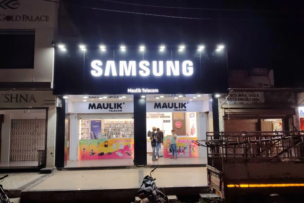 Illuminated Samsung storefront signage at night