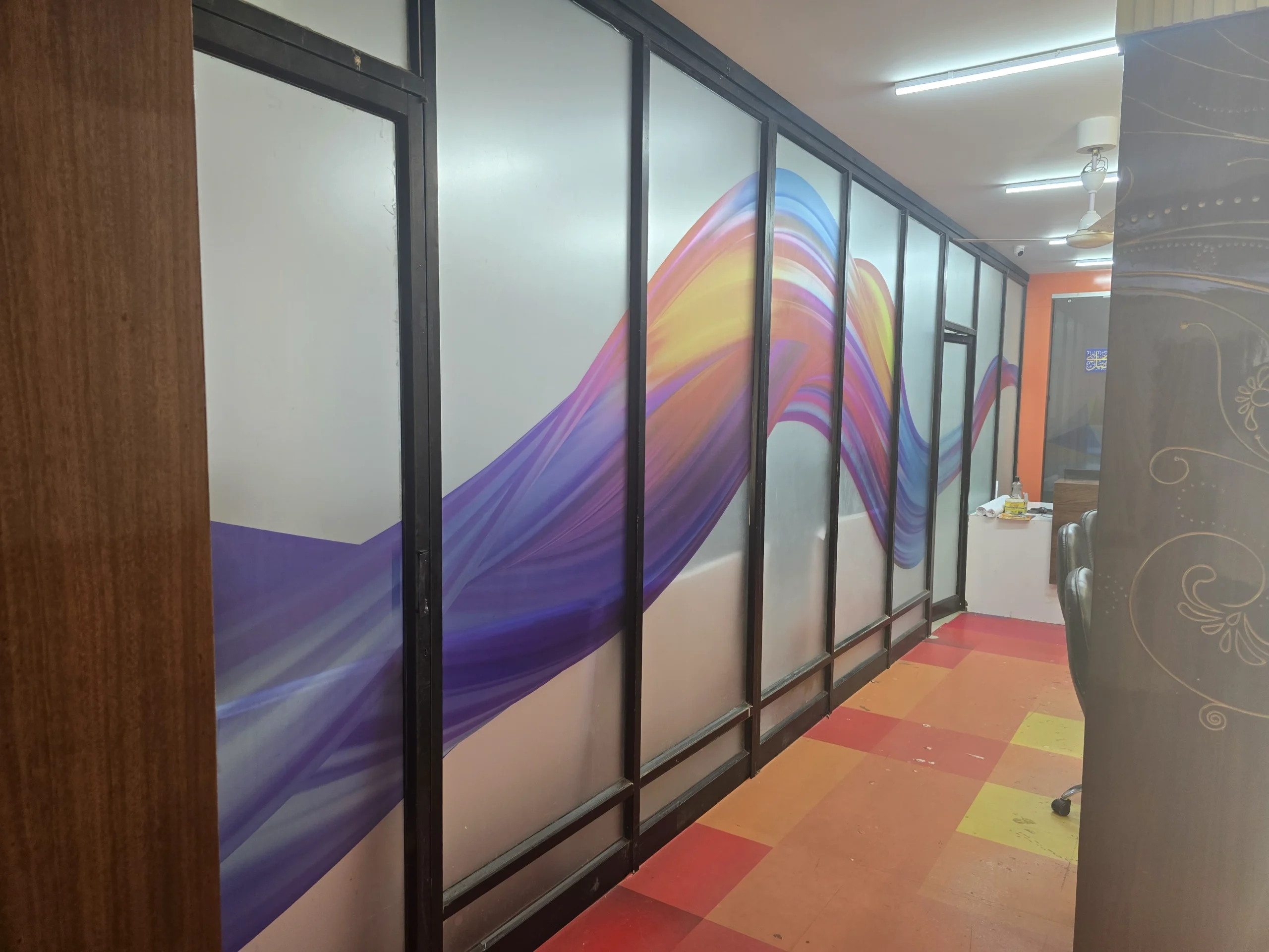 BREIR office flowing coloured graphics on glass partition